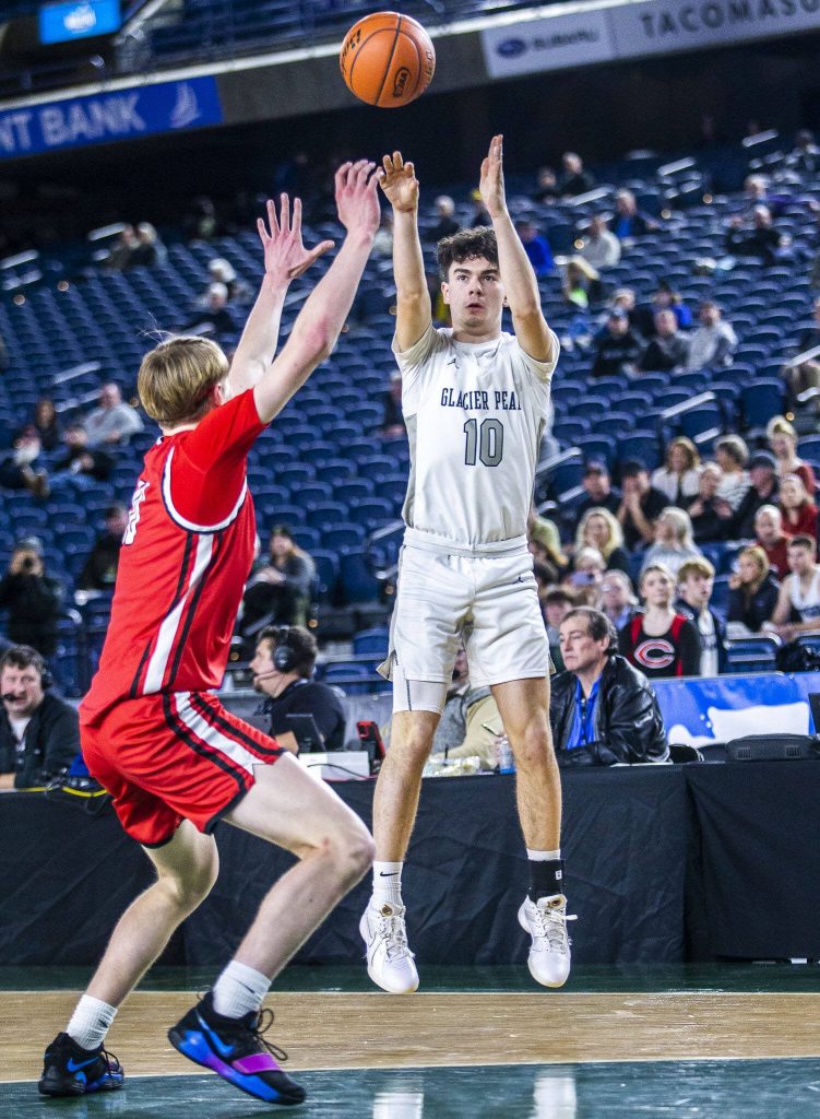 Glacier Peaks Samuel Waldow makes a three point shot during the 4A boys state basketball game against Camas on Wednesday, Feb. 28, 2024 in Tacoma, Washington. (Olivia Vanni / The Herald)