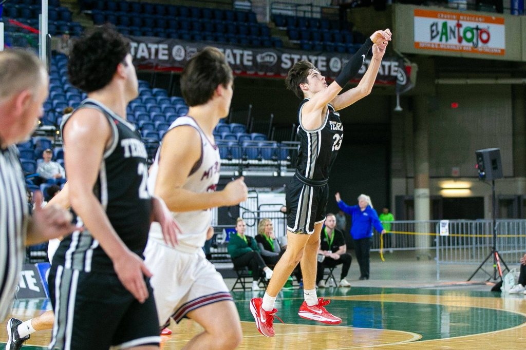 Mountlake Terraces Brody Myers-Little hits a buzzer-beater from well beyond half court during a WIAA 3A Boys Basketball quarterfinal against Mount Spokane on Thursday, Feb. 29, 2024, at the Tacoma Dome in Tacoma, Washington. (Ryan Berry / The Herald)