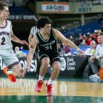 Mountlake Terraces Logan Tews keeps possession of a loose ball during a WIAA 3A Boys Basketball quarterfinal against Mount Spokane on Thursday, Feb. 29, 2024, at the Tacoma Dome in Tacoma, Washington. (Ryan Berry / The Herald)