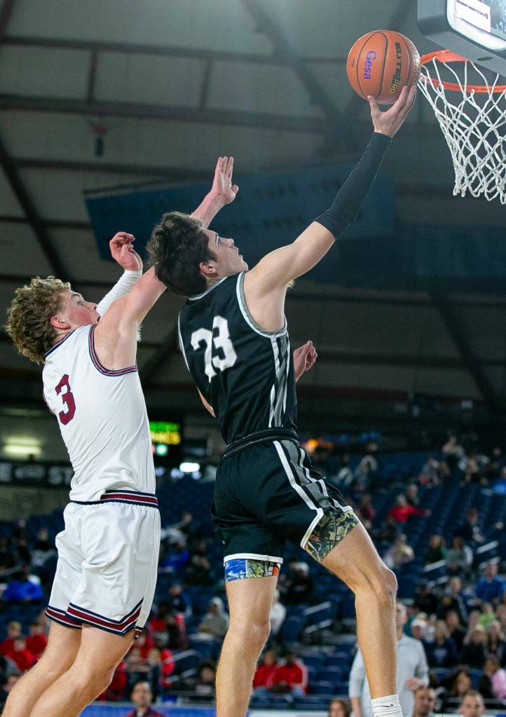 Mountlake Terrace junior Brody Myers-Little scores on a steal and breakaway during a WIAA 3A Boys Basketball quarterfinal against Mount Spokane on Thursday, Feb. 29, 2024, at the Tacoma Dome in Tacoma, Washington. (Ryan Berry / The Herald)