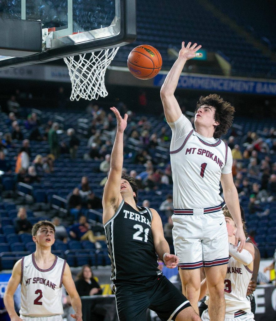 Mountlake Terraces Logan Tews is blocked by Andrew Rayment during a WIAA 3A Boys Basketball quarterfinal against Mount Spokane on Thursday, Feb. 29, 2024, at the Tacoma Dome in Tacoma, Washington. (Ryan Berry / The Herald)