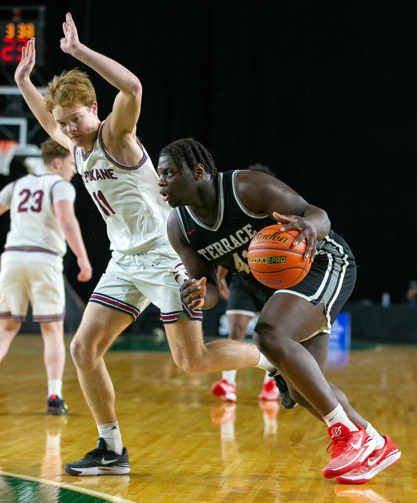 Mountlake Terrace senior Zaveon Jones drives on a defender during a WIAA 3A Boys Basketball quarterfinal against Mount Spokane on Thursday, Feb. 29, 2024, at the Tacoma Dome in Tacoma, Washington. (Ryan Berry / The Herald)