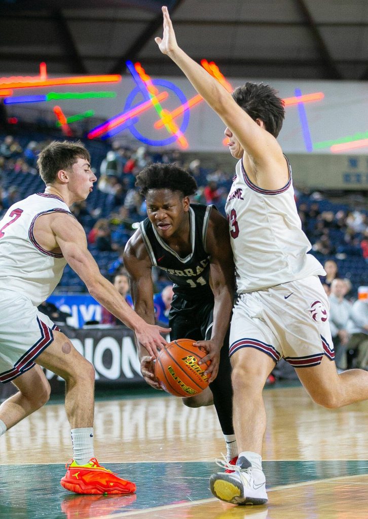 Mountlake Terrace junior Rayshaun Connor tries to split the defense during a WIAA 3A Boys Basketball quarterfinal against Mount Spokane on Thursday, Feb. 29, 2024, at the Tacoma Dome in Tacoma, Washington. (Ryan Berry / The Herald)