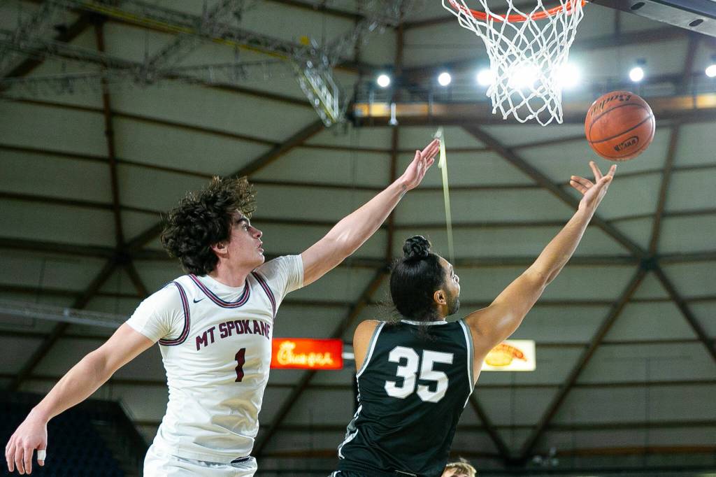 Mountlake Terraces Svayjeet Singh tries for an up-and-under during a WIAA 3A Boys Basketball quarterfinal against Mount Spokane on Thursday, Feb. 29, 2024, at the Tacoma Dome in Tacoma, Washington. (Ryan Berry / The Herald)
