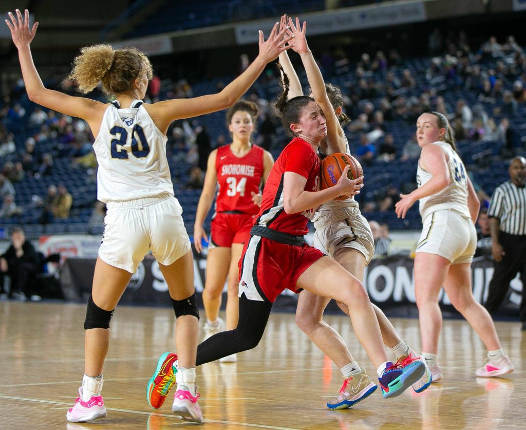 Snohomishs Sienna Capelli drives through the defense on her way to the rim during a WIAA 3A Girls Basketball quarterfinal against Arlington on Thursday, Feb. 29, 2024, at the Tacoma Dome in Tacoma, Washington. (Ryan Berry / The Herald)