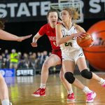 Arlingtons Samara Morrow handles the ball and looks for a pass during a WIAA 3A Girls Basketball quarterfinal against Snohomish on Thursday, Feb. 29, 2024, at the Tacoma Dome in Tacoma, Washington. (Ryan Berry / The Herald)