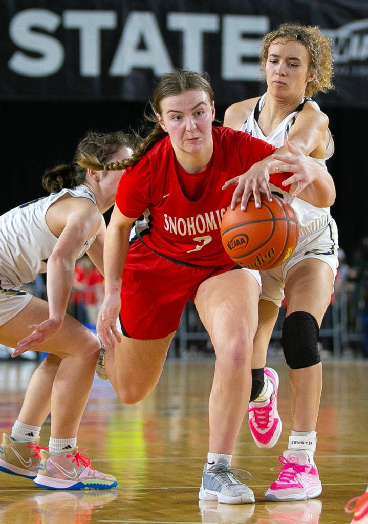 Snohomish sophomore Kendall Hammer gets fouled while driving to the paint during a WIAA 3A Girls Basketball quarterfinal against Arlington on Thursday, Feb. 29, 2024, at the Tacoma Dome in Tacoma, Washington. (Ryan Berry / The Herald)