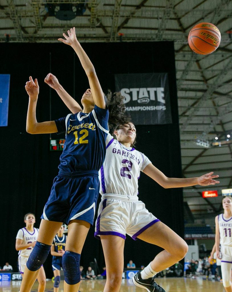 Everetts Alana Washington is blocked by Katie Fiso during a WIAA 3A Girls Basketball quarterfinal against Garfield on Thursday, Feb. 29, 2024, at the Tacoma Dome in Tacoma, Washington. (Ryan Berry / The Herald)