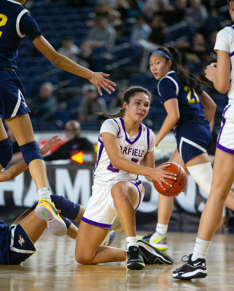 Garfields Jayda Lewis comes up with a loose ball during a WIAA 3A Girls Basketball quarterfinal against Garfield on Thursday, Feb. 29, 2024, at the Tacoma Dome in Tacoma, Washington. (Ryan Berry / The Herald)