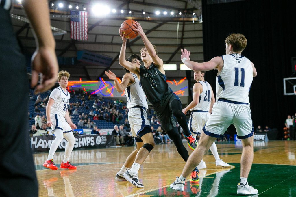 Glacier Peak junior Jo Lee splits the defense on his way to the basket during a WIAA 4A Boys Basketball quarterfinal against Gonzaga Prep on Thursday, Feb. 29, 2024, at the Tacoma Dome in Tacoma, Washington. (Ryan Berry / The Herald)