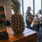 Live music is played in the terminal before the first flight from Paine Field to Honolulu on Nov. 17, 2023 in Everett. (Olivia Vanni / The Herald)