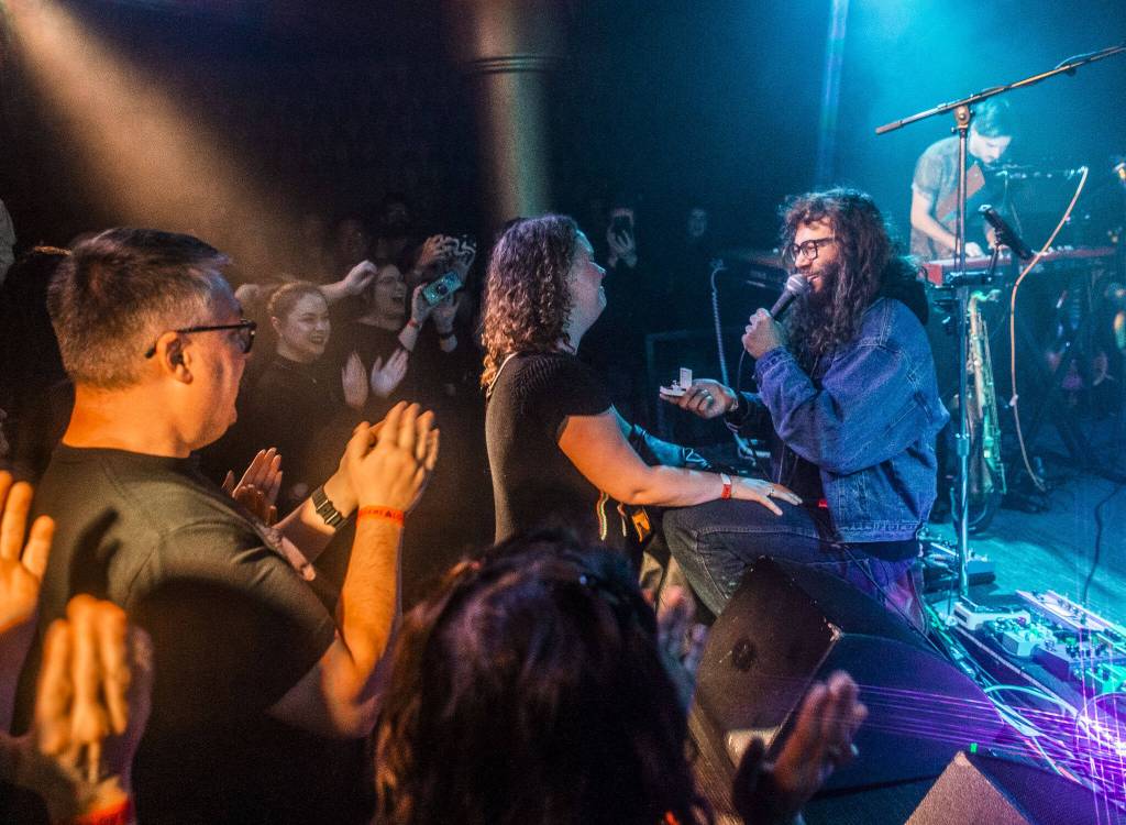 Brandon Hailey of Cytrus proposes to his girlfriend, Laila McKinley, during the bands headlining show at Madame Lous on Friday, Dec. 29, 2023 in Seattle, Washington. (Olivia Vanni / The Herald)