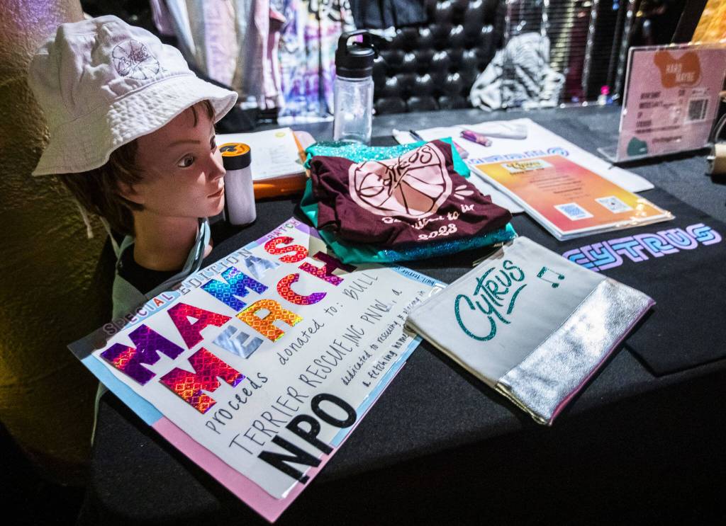 Merchandise for the band Cytrus displayed during a headlining show at Madame Lous on Friday, Dec. 29, 2023 in Seattle, Washington. (Olivia Vanni / The Herald)