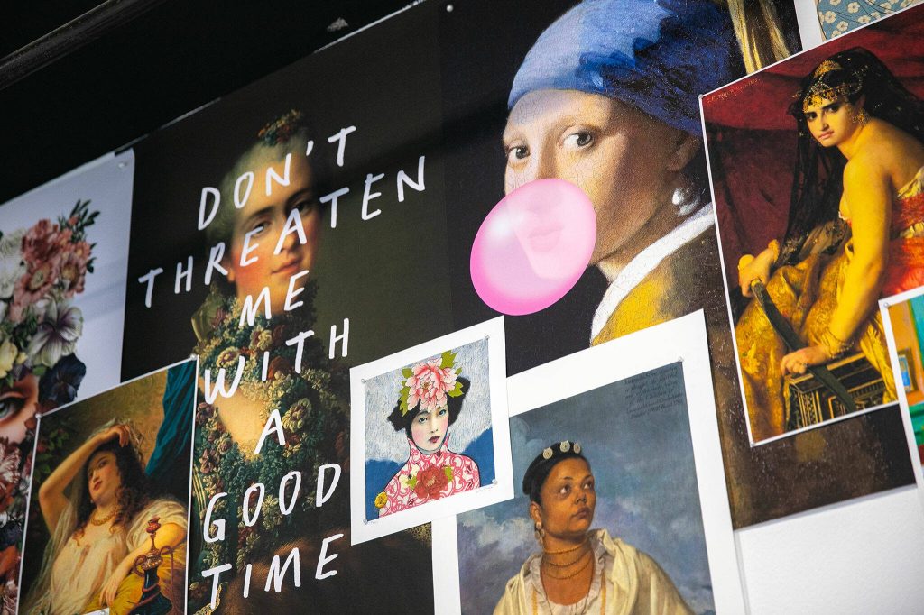 Wall hangings at Bandbox Beauty celebrate women in art.