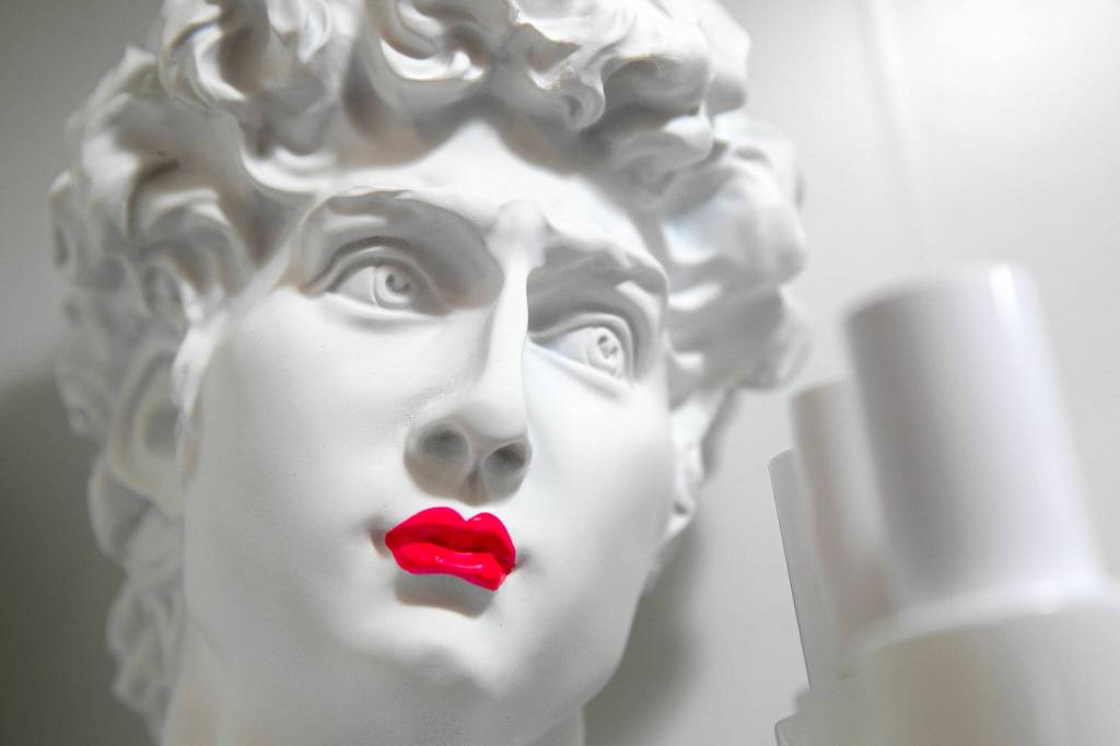 Lipstick adorns a decorative statue at Bandbox Beauty. (Ryan Berry / The Herald)