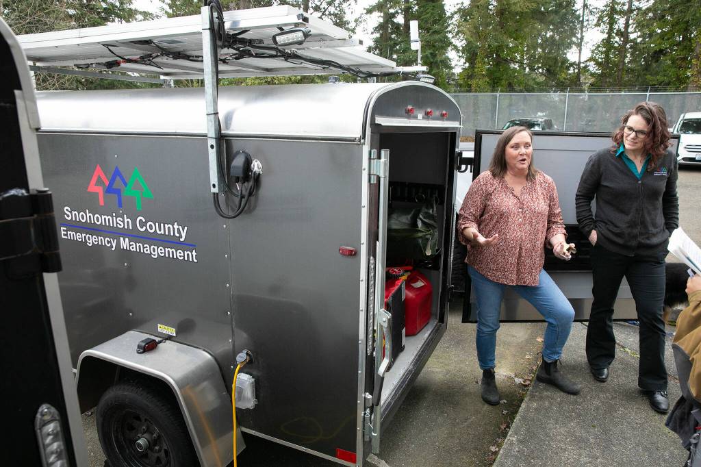 Director Lucia Schmit, right, and Deputy Director Dara Salmon show the contents of a MITRU outside the Snohomish County Department of Emergency Management on Friday, March 8, 2024, in Everett, Washington. (Ryan Berry / The Herald)