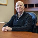 Mark Duffy poses for a photo in his office at the Mountain Pacific Bank headquarters on Wednesday, Feb. 14, 2024 in Everett, Washington. (Annie Barker / The Herald)
