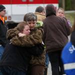 Neighbors gather at the Oso Fire Department to look for updates about the fatal mudslide that washed over homes and over Highway 530 east of Oso, Wash., Saturday morning, March 22, 2014. Highway 530 was closed in both directions, and authorities confirmed at least 2 fatalities by Saturday afternoon. (Annie Mulligan / For The Herald)