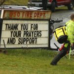 Volunteers arrive at the Oso Fire Department Tuesday March 24, 2014. (Mark Mulligan / The Herald)