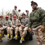 National Guard troops prepare to enter the mudslide debris on the western edge of the mudslide where it covers Highway 530 Wednesday, March 26, 2014 morning east of Oso, Wash. (Mark Mulligan / The Herald)