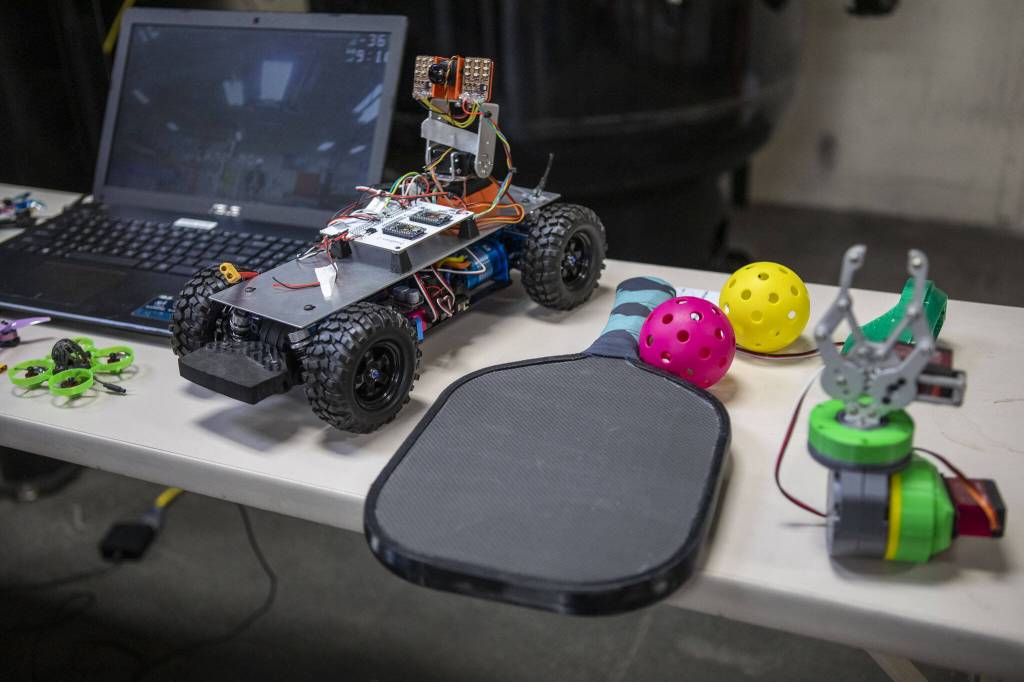 Student projects including drones and a pickleball paddle are displayed at the Washington Aerospace Training and Research Center on Wednesday, March 6, 2024 in Everett, Washington. (Annie Barker / The Herald)