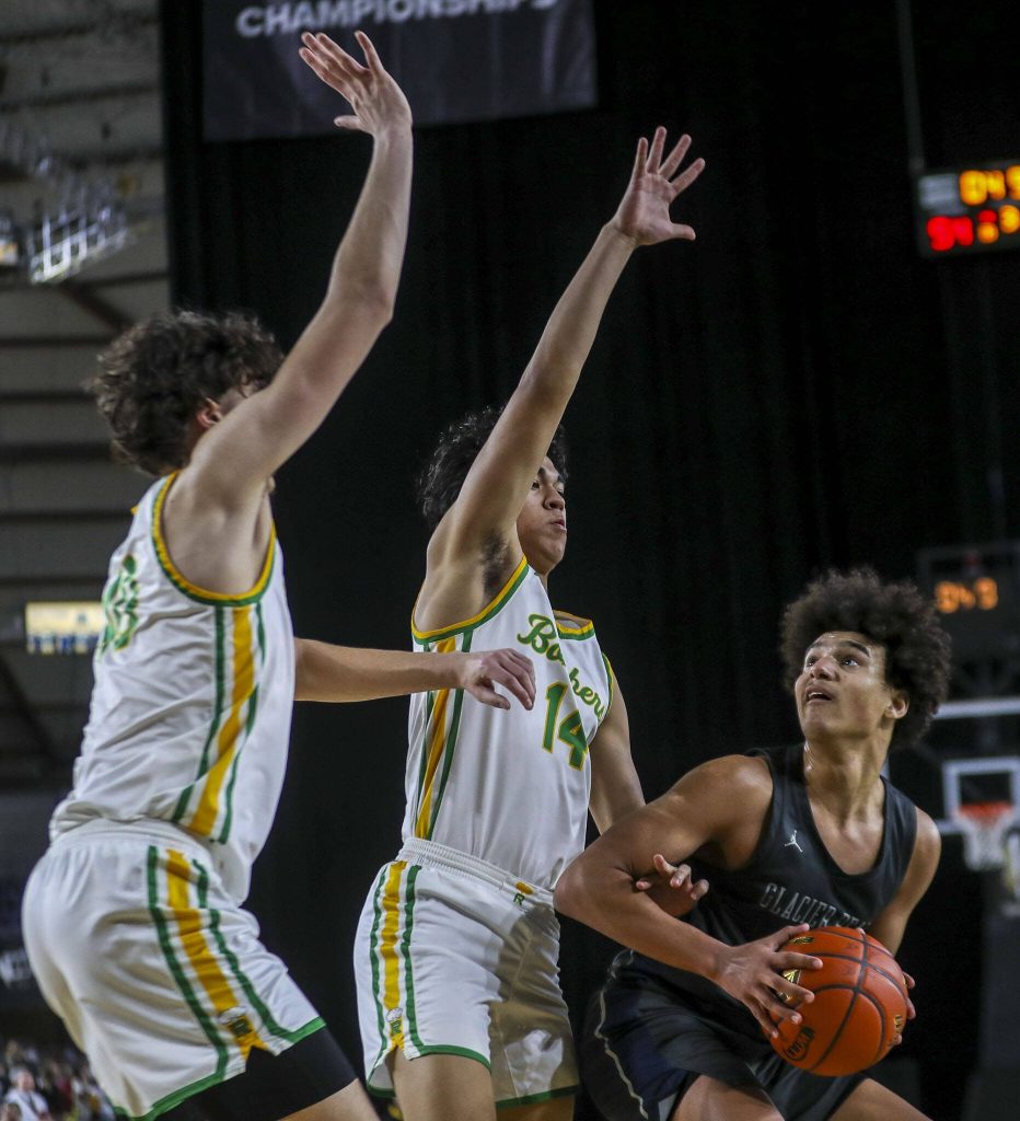 Glacier Peaks Jayce Nelson (21) shoots the ball during a 4A semifinal game between Glacier Peak and Richland at the Tacoma Dome on Friday, March 1, 2024 in Tacoma, Washington. Glacier Peak fell, 70-59. (Annie Barker / The Herald)