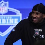 Washington quarterback Michael Penix speaks during a press conference at the NFL football scouting combine in Indianapolis, Friday, March 1, 2024. (AP Photo/Michael Conroy)