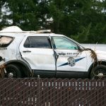 A heavily damaged Washington State Patrol vehicle is hauled away after a crash killed a trooper on southbound I-5 overnight Saturday, March 2, 2024, in Marysville, Washington. (Ryan Berry / The Herald)