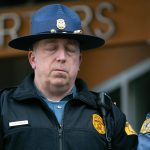 Washington State Patrol Lt. Christopher Caiola shuts his eyes while listening to Chief John Batiste address the media during a press conference regarding an overnight crash that killed trooper Chris Gadd on southbound I-5 Saturday, March 2, 2024, in Marysville, Washington. (Ryan Berry / The Herald)