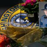Flowers for slain trooper Chris Gadd begin to collect outside Washington State Patrol District 7 Headquarters on Saturday, March 2, 2024, in Marysville, Washington. (Ryan Berry / The Herald)