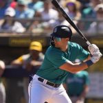 Seattle Mariners' Dominic Canzone looks for a pitch during a spring training baseball game against the Oakland Athletics, Saturday, March 2, 2024, in Peoria, Ariz. (AP Photo/Lindsey Wasson)