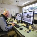 Traffic engineer Corey Hert pulls up a live traffic feed at the Traffic Management Center on Thursday, March 7, 2024 in Everett, Washington. (Olivia Vanni / The Herald)