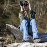 Rachel Haight from the Whale Sighting Network looks for gray and orca whales on Monday, March 18, 2024 at Hidden Beach in Greenbank, Washington. (Annie Barker / The Herald)