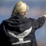 Cindi Rausch looks for whales on Monday, March 18, 2024 on Whidbey Island in Washington. (Annie Barker / The Herald)