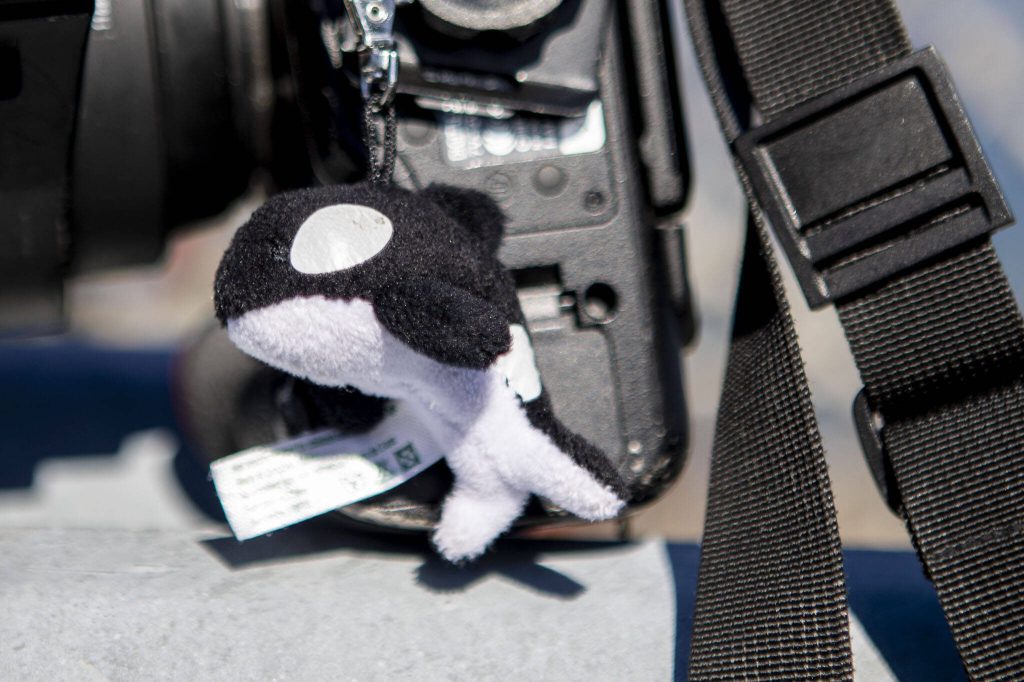 Cindi Rauschs orca keychain attached to her camera on Monday, March 18, 2024 near Sandy Point in Langley, Washington. (Annie Barker / The Herald)