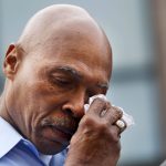 Snohomish County Executive John Lovick wipes a tear during a briefing in downtown Arlington Monday morning, March 24, 2014. (Annie Mulligan / The Herald)