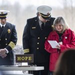 Gail Thompson is comforted by Chaplin Joel Johnson while she reads a speech she wrote earlier in the morning at the Oso Memorial on Tuesday, March 22, 2022 in Oso, Washington. (Olivia Vanni / The Herald)