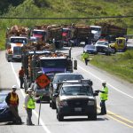 A line of vehicles line up eastbound on Highway 530 west of the mudslide waiting to take the service road bypass of 530 to Darrington, Washington on April 29, 2014. Locals called it catching the ferry as only one lane of traffic was let through the road at a time. The road was cut by loggers and other volunteers in the weeks following the slide. (Mark Mulligan / The Herald)