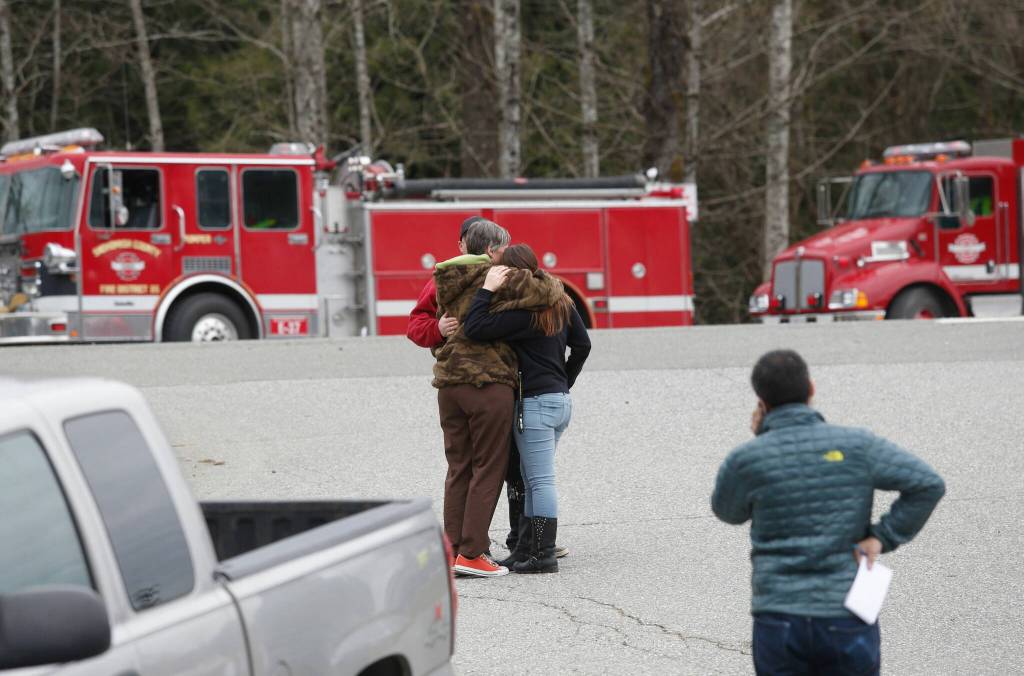 Residents gather at the Oso Fire Department to look for updates about the mudslide in Oso, Washington, on March 22, 2014. (Annie Mulligan / For The Herald)
