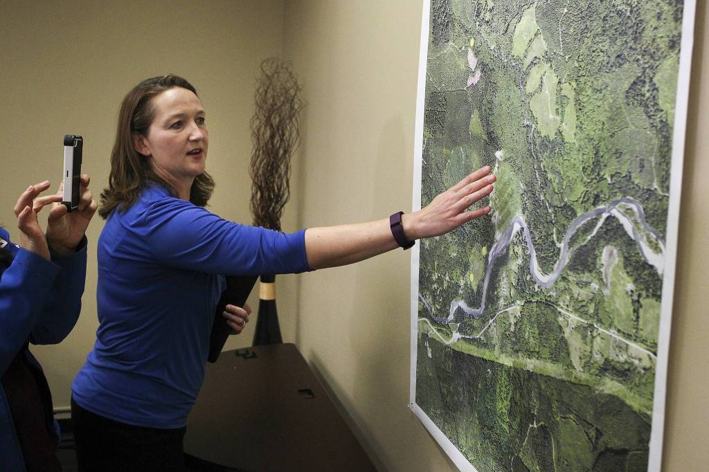 Shari Ireton, spokeswoman for the Snohomish County Sheriffs Office, goes over a map showing the location of two bodies discovered close to where missing couple Patrick Shunn and Monique Patenauds vehicles were found, during a press conference May 24, 2016 in Everett. (Ian Terry / The Herald)