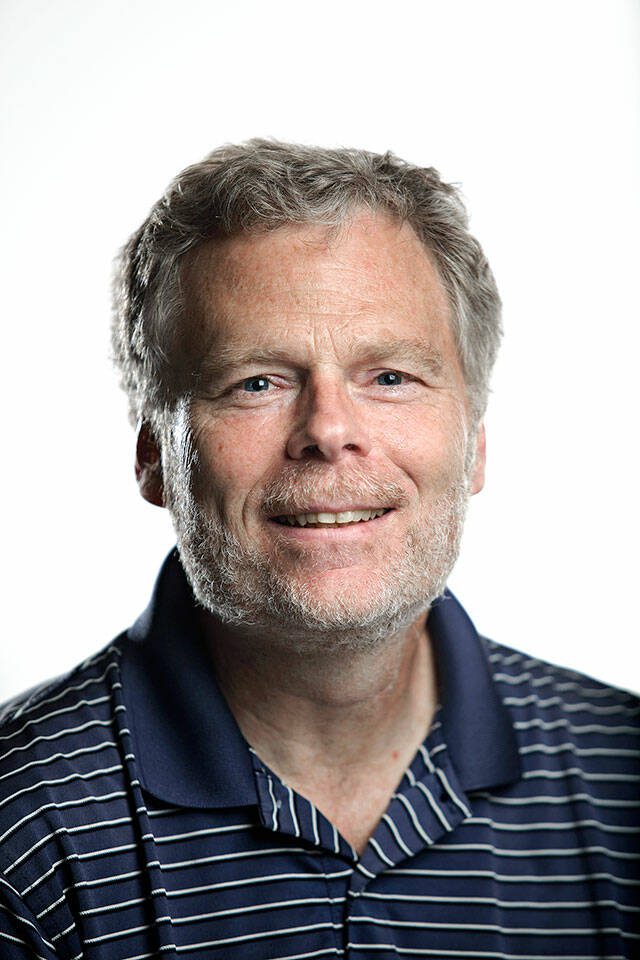 Herald Reporter Eric Stevick Photographed in Herald studio July 19, 2013 (Mark Mulligan / The Herald)