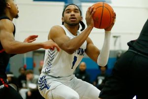 Edmonds College’s Chris Lee head fakes a shot against Everett Community College on Wednesday, Feb. 7, 2024, at Seaview Gym in Lynnwood, Washington. (Ryan Berry / The Herald)