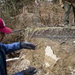 Steve Hall talks about how high the water reached when the road was washed out on Wednesday, March 6, 2024 in Marysville, Washington. (Olivia Vanni / The Herald)
