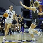 Northern Arizona Universitys Emily Rodabaugh, an Archbishop Murphy High School graduate, takes the ball down the court during a game in Flagstaff, Ariz. (Photo courtesy of Northern Arizona University)