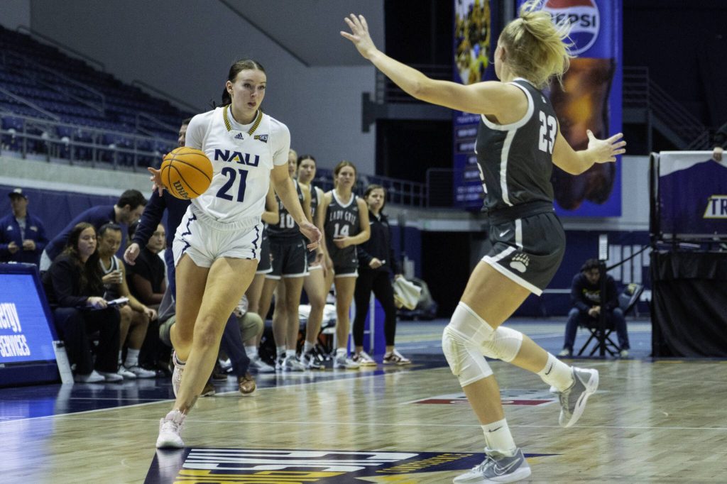 Northern Arizona Universitys Emily Rodabaugh, an Archbishop Murphy High School graduate, takes the ball down the court during a game in Flagstaff, Ariz. (Photo courtesy of Northern Arizona University)