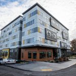 Outside of Compass Health’s Andy’s Place residence next to the Broadway construction site of Compass Health’s new mental health facility on Wednesday, Nov. 29, 2023 in Everett, Washington. (Olivia Vanni / The Herald)