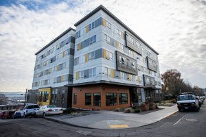 Outside of Compass Health’s Andy’s Place residence next to the Broadway construction site of Compass Health’s new mental health facility on Wednesday, Nov. 29, 2023 in Everett, Washington. (Olivia Vanni / The Herald)