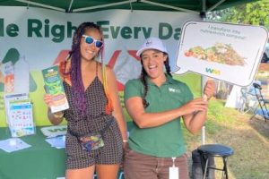Rhianne poses with Bremerton Farmers Market attendee