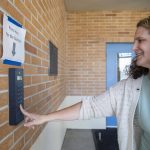 Lakewood School District Superintendent Erin Murphy rings the doorbell at secure front entrance at Lakewood Elementary School on Tuesday, March 19, 2024, in Marysville, Washington. (Olivia Vanni / The Herald)