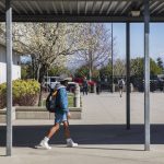 Students make their way through a portion of a secure gate and fence located only in the front of Lakewood Elementary School on Tuesday, March 19, 2024 in Marysville, Washington. Fencing the entire campus is something that would hopefully be upgraded with funds from the levy. (Olivia Vanni / The Herald)